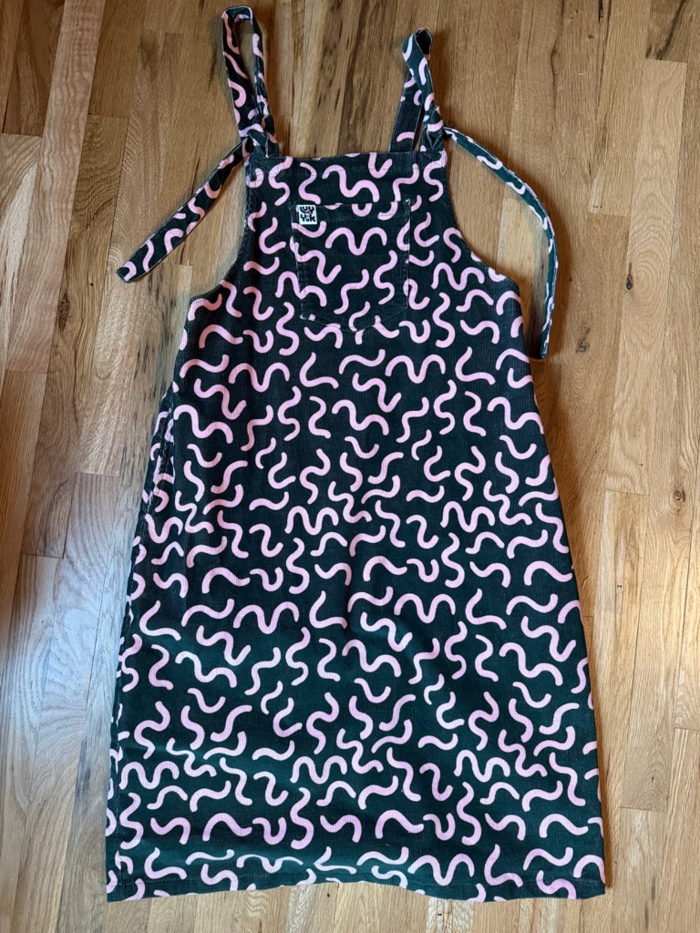 Lucy & Yak Dark Green Pinafore Dress with Pink Squiggle Print